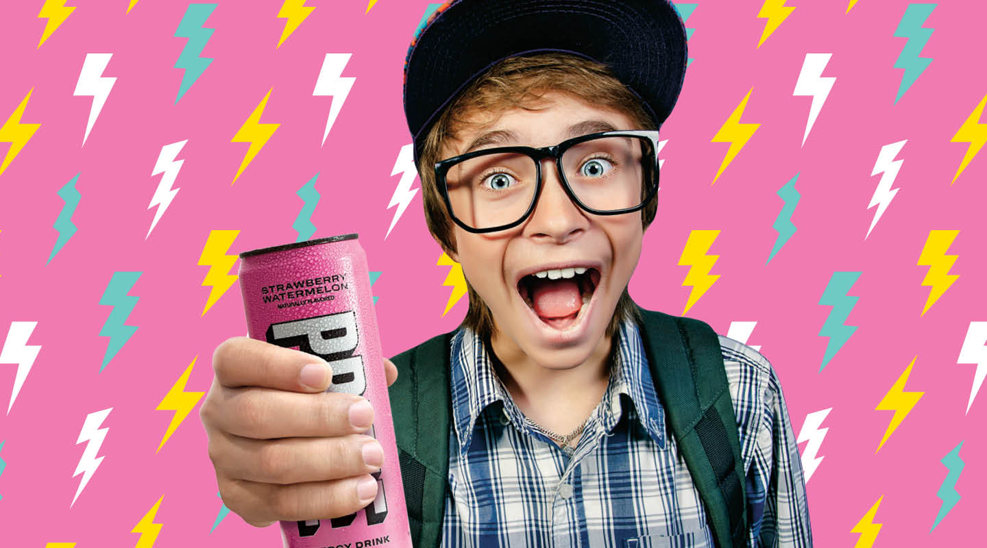 Image of a teen holding a strawberry lemonade Prime drink against backdrop of lightning bolts